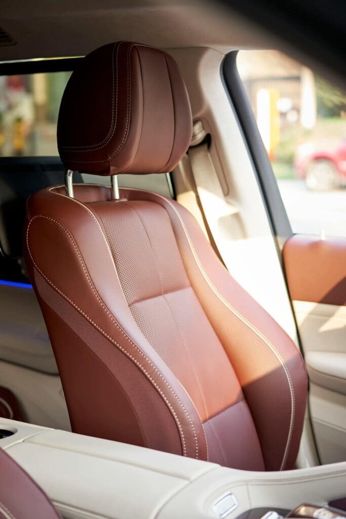 leather automotive upholstery driver seat with detailed stitching and contoured design